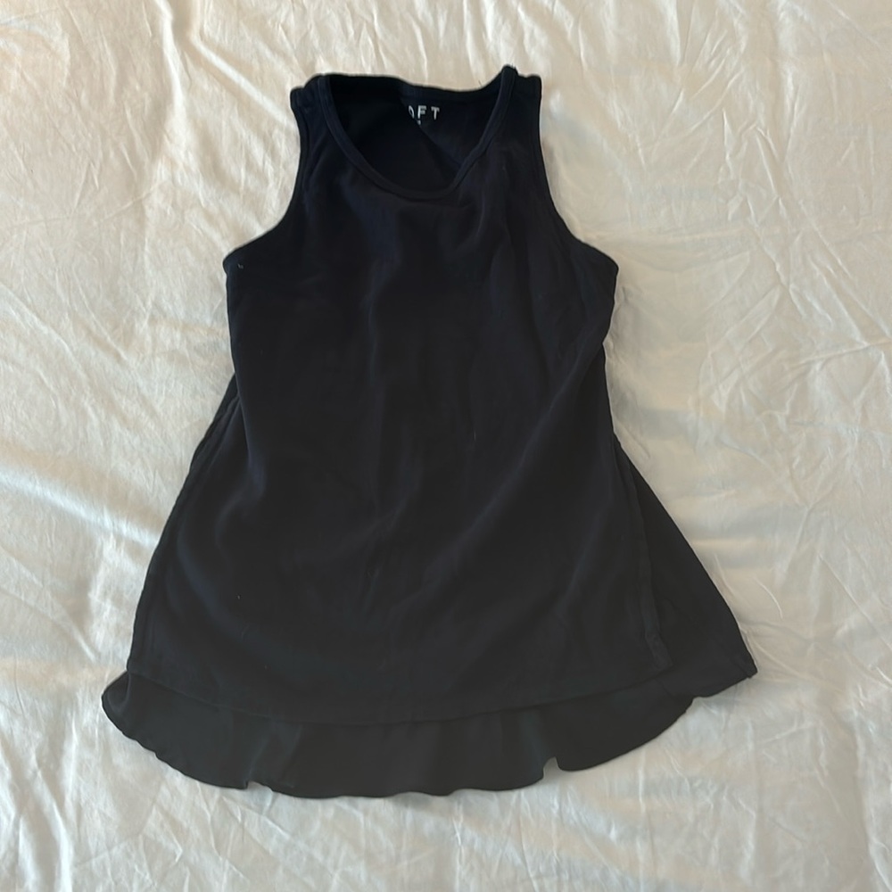 Knit sleeveless top with ruffled hem